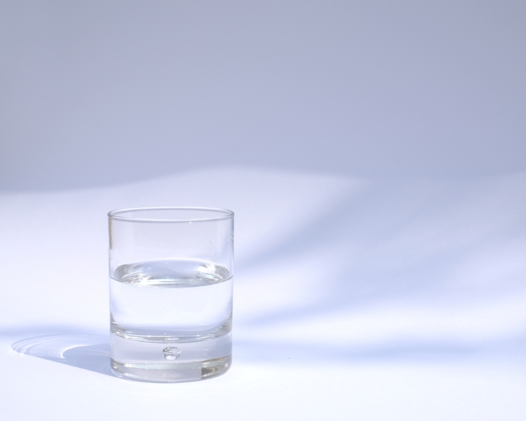 Glass of water on a surface