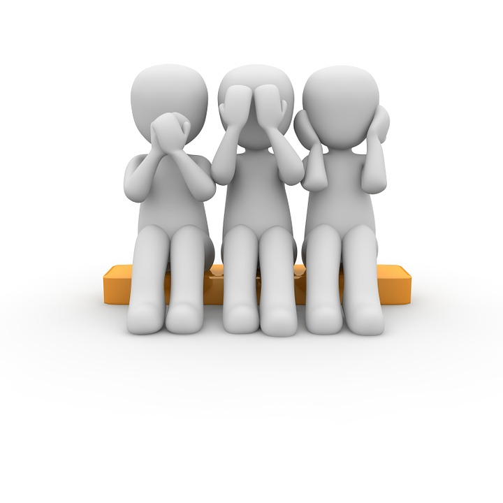 Three people, one covering eyes, one mouth, and one ears