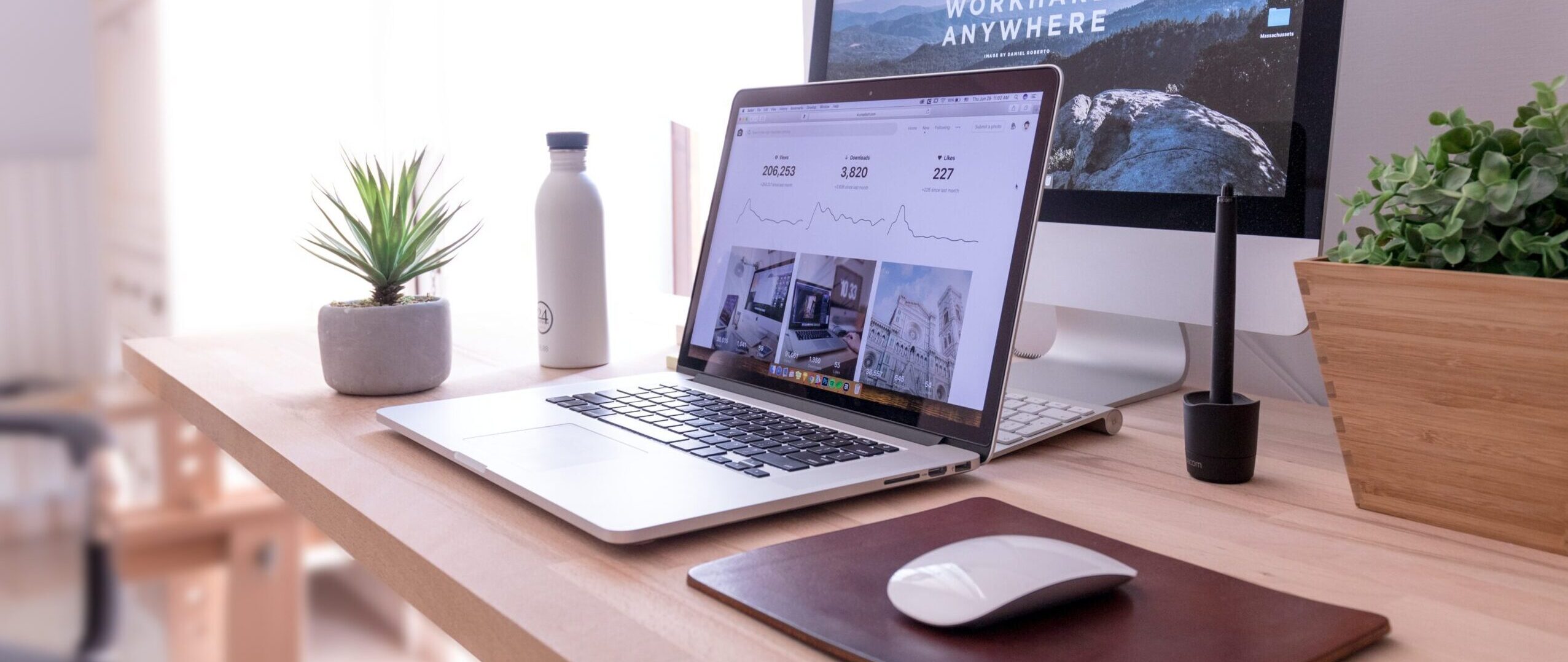 Laptop open on an organised desk