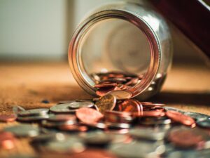 Jar of coins spilled over