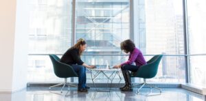 Two women at a table in a business environment